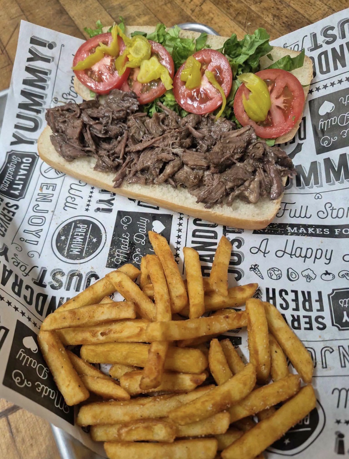 Roast beef po'boy with fries